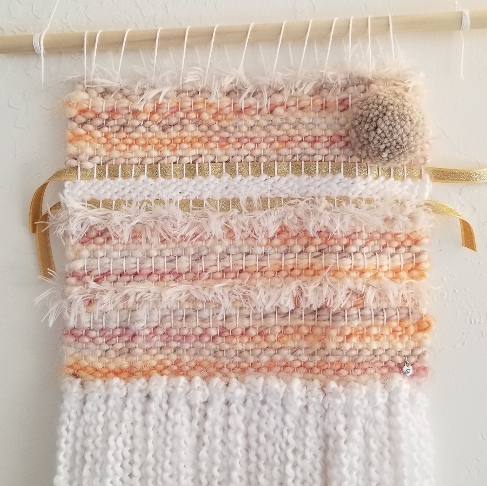 HANDMADE pastel and white wall hanging.